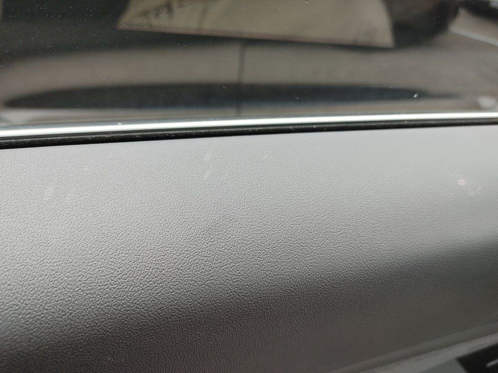 A close up of the dashboard of a car.