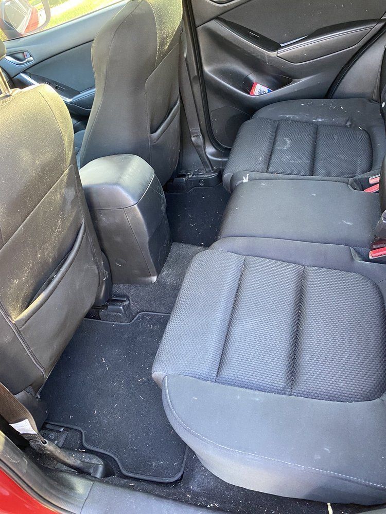 The rear seats of a car are dirty and dirty.