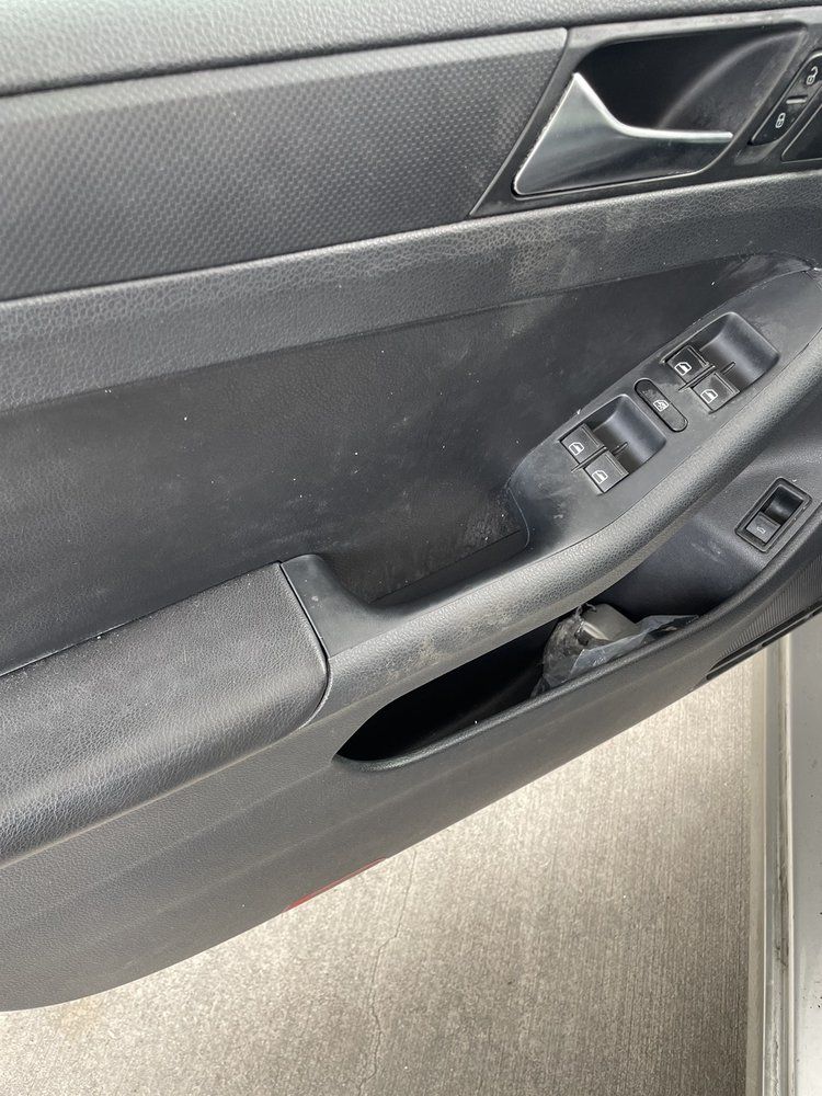 A close up of the door handle of a car.
