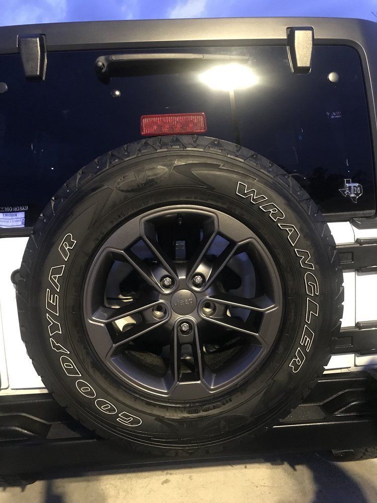 A close up of a tire on a jeep wrangler