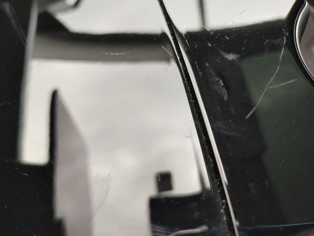 A close up of a cracked windshield on a car