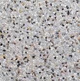 Close-up view of a speckled light gray aggregate stone surface with small, varied pebbles.