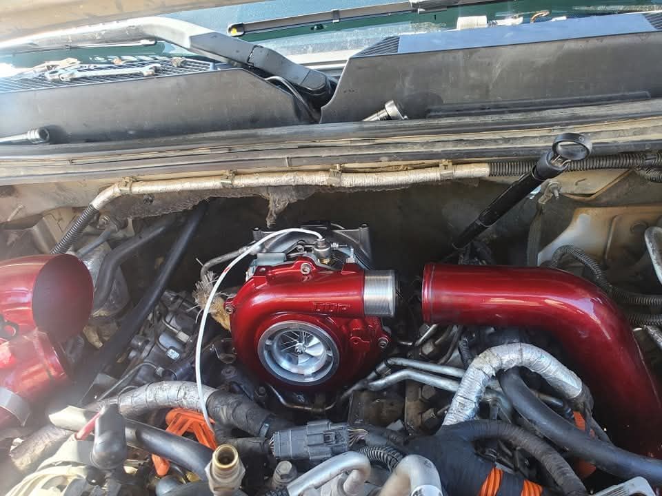 A close up of a thermostat on a car engine