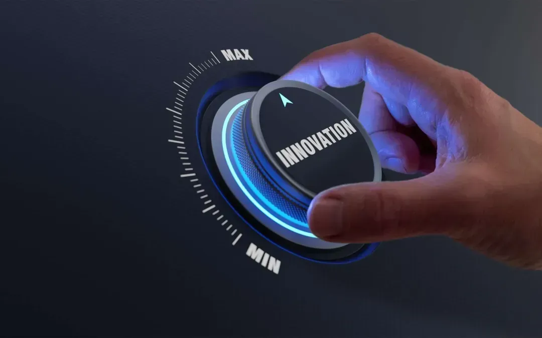 A person is pressing a button that says innovation on it.