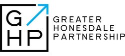 Greater Homesdale Partnership logo with black letters and a blue upward arrow