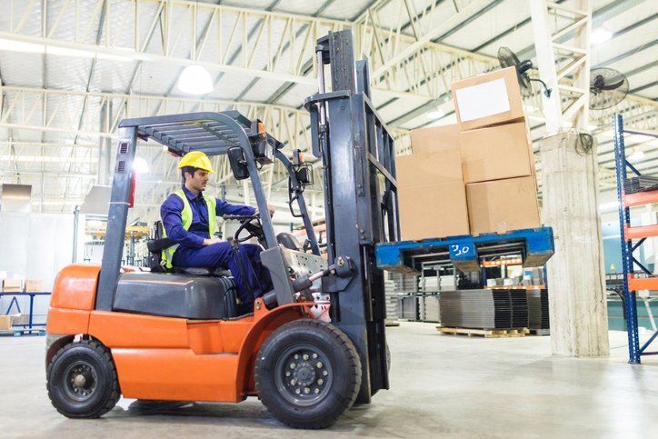 Moving cardboard boxes by forklift loader | Queanbeyan East, NSW | Specialized Forklift Services