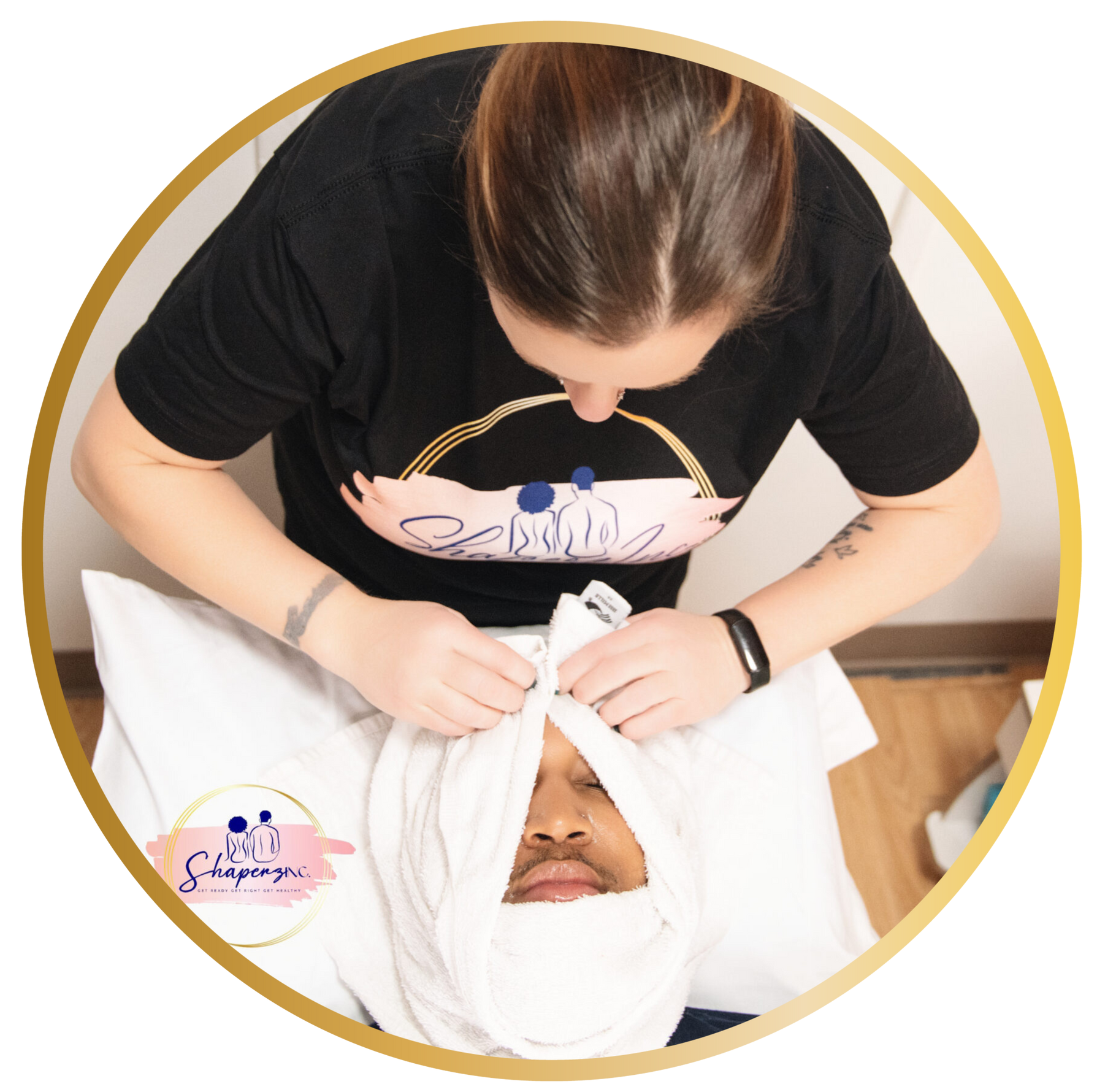 A woman is wrapping a child 's face in a towel