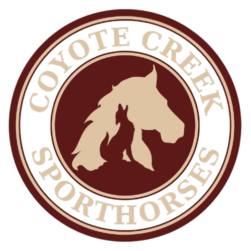 Logo for Coyote Creek Sporthorses: A tan horse head silhouette featuring a howling coyote inside, on a maroon circle.