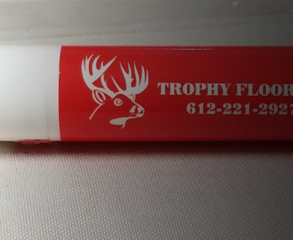 A red and white trophy floor with a deer on it
