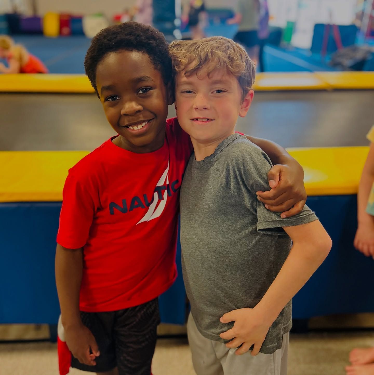 A young girl is covered in foam at a foam party.