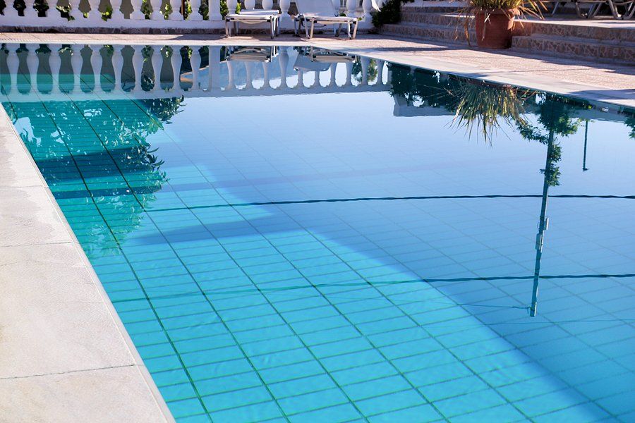 a deck finish beside a pool