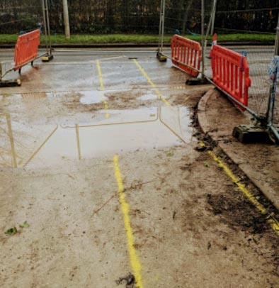 Yellow marking painted on a road before excavation