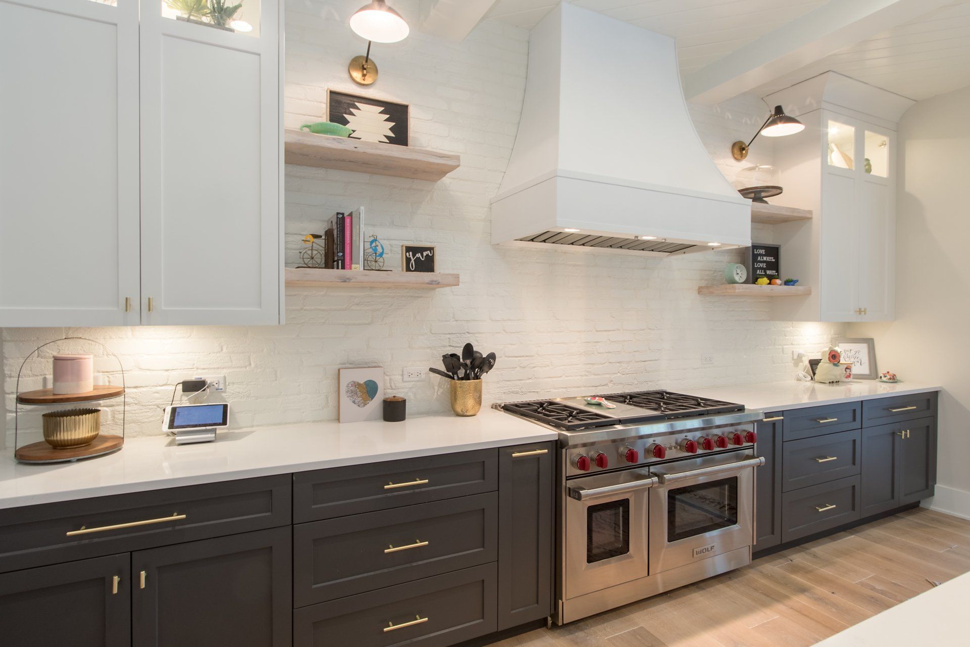 A kitchen with stainless steel appliances and gray cabinets.