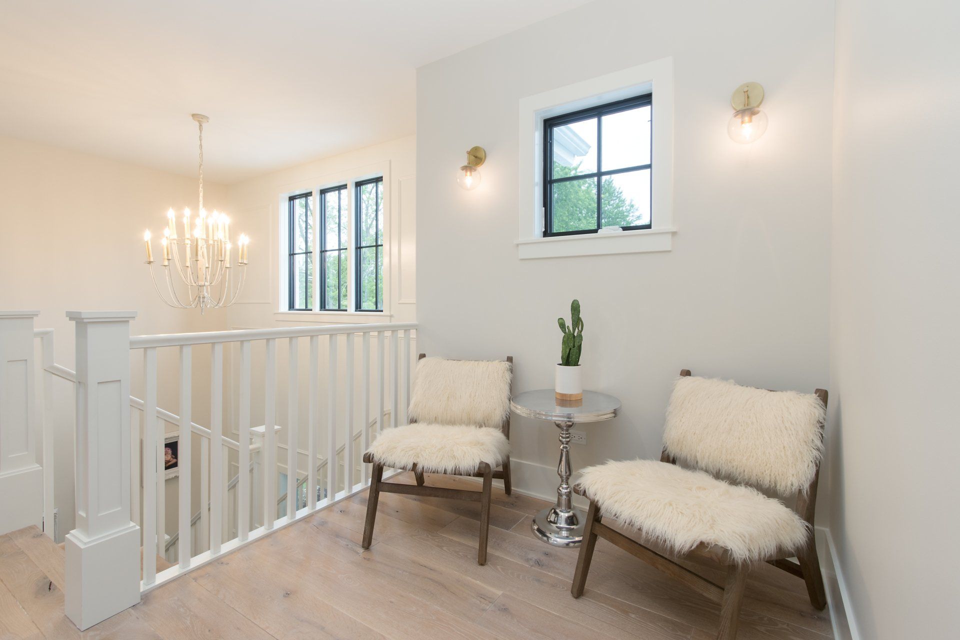 There are two chairs and a table in the room.