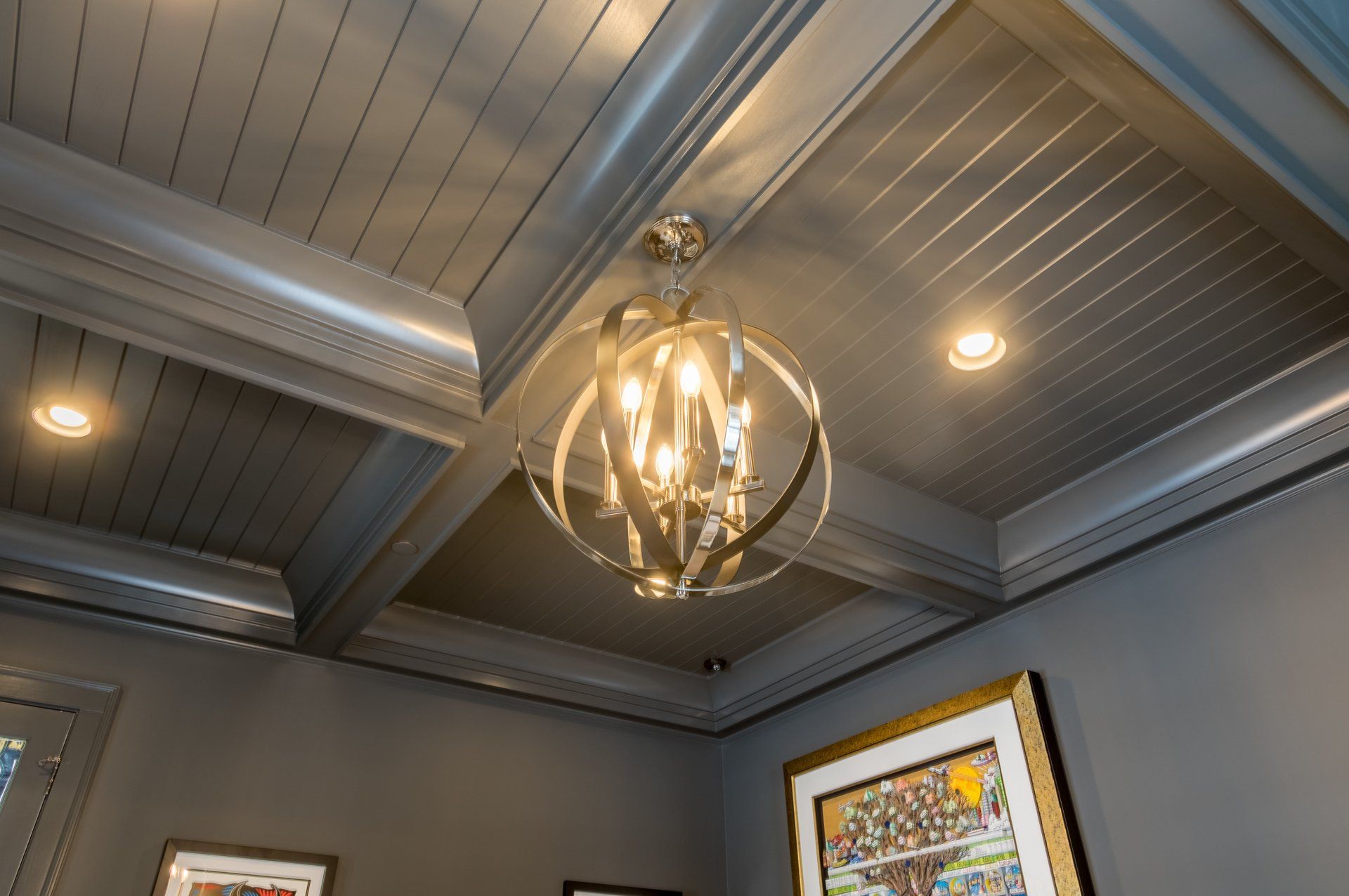 A chandelier is hanging from the ceiling of a room.