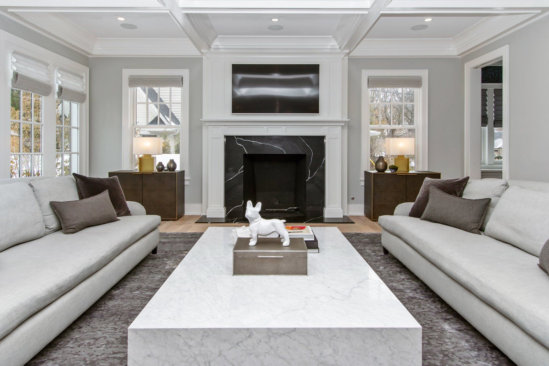 A living room filled with furniture and a fireplace.