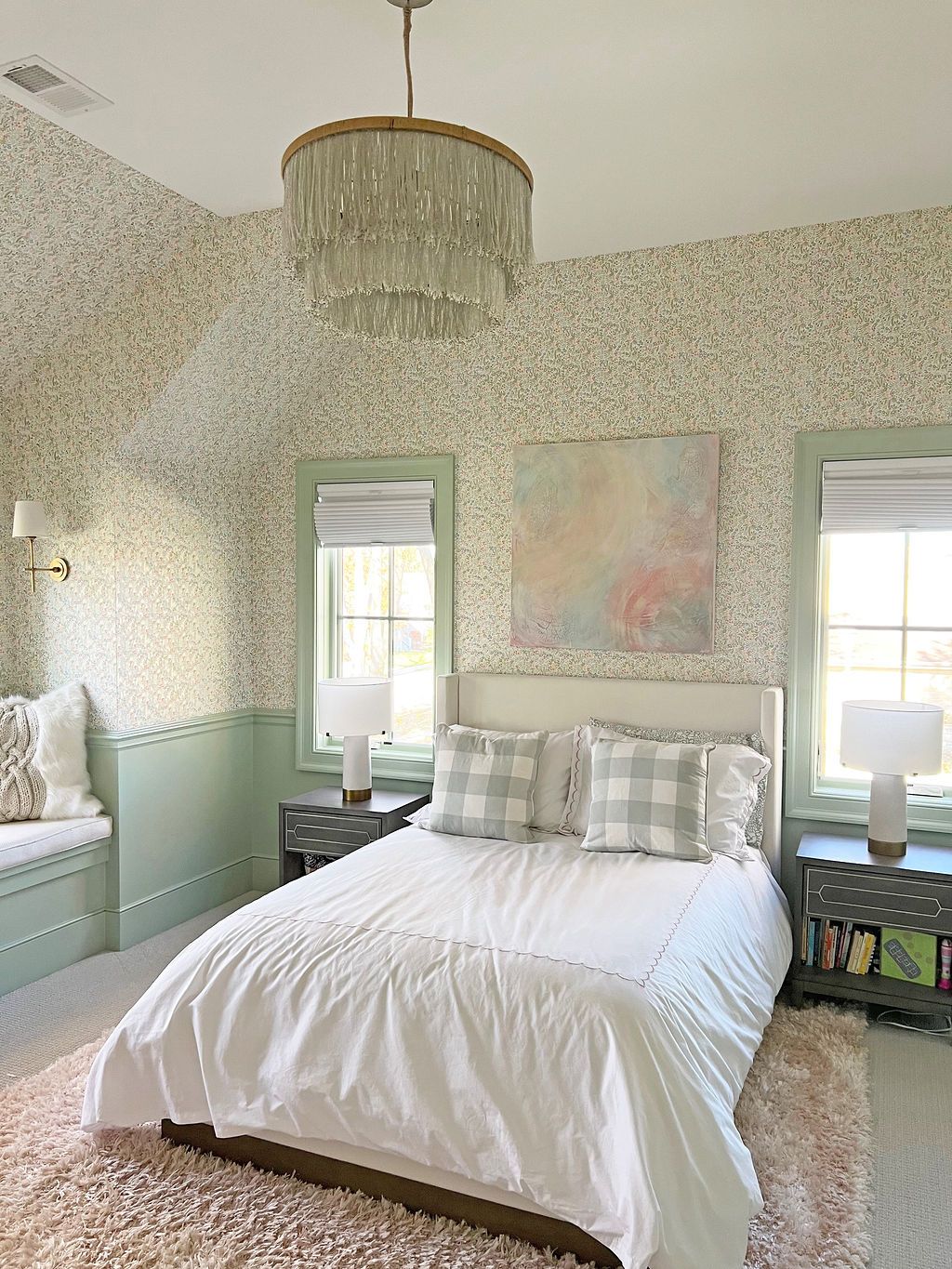 Bedroom with floral wallpaper, white bedding, and a chandelier; light green accents.