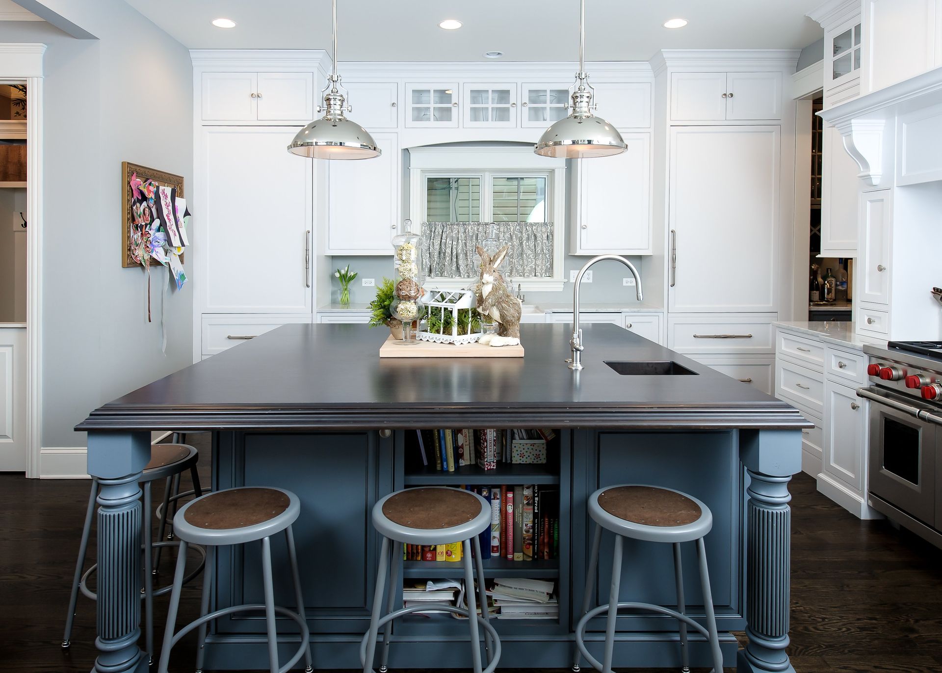 A kitchen with a large island and stools