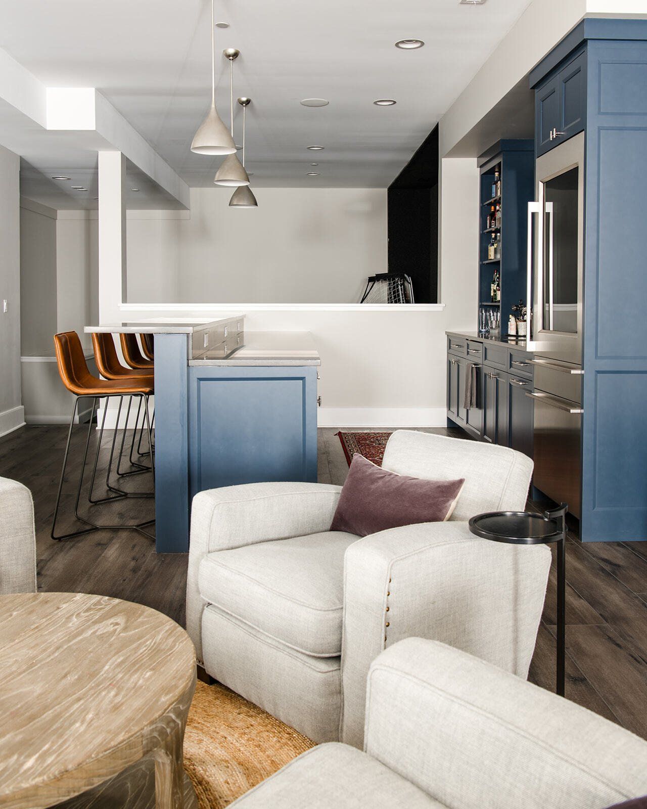 A living room with a couch a chair and a table