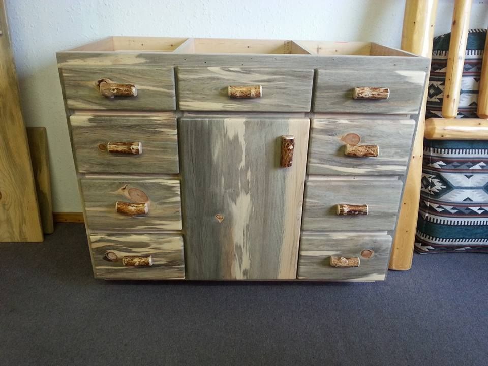 A wooden dresser with drawers and a door