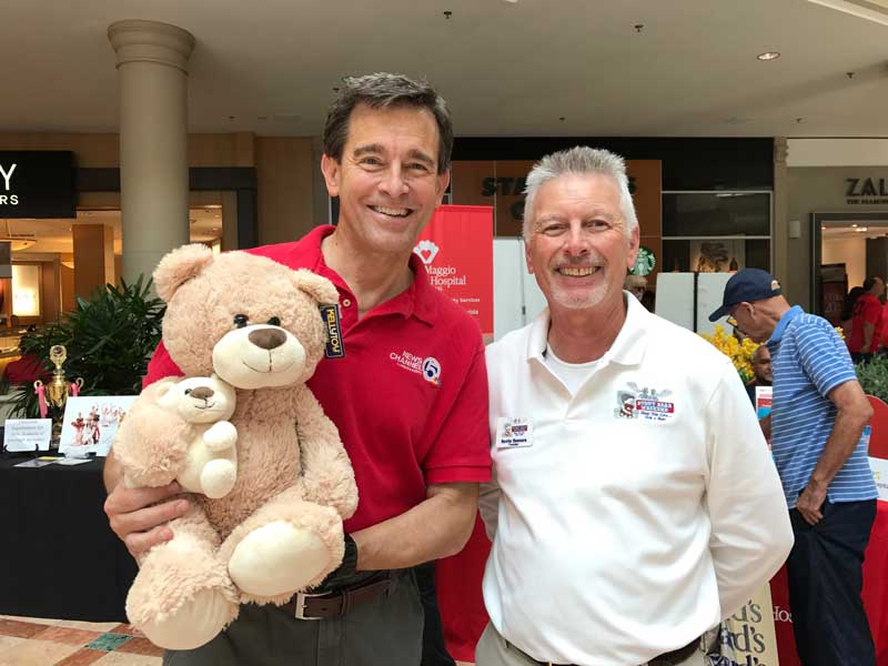 WPTV News Anchor Mike Williams and Buddy Bear® weekend Founder Kevin Bonura at WPTV The Back to School Expo with Buddy Bear®