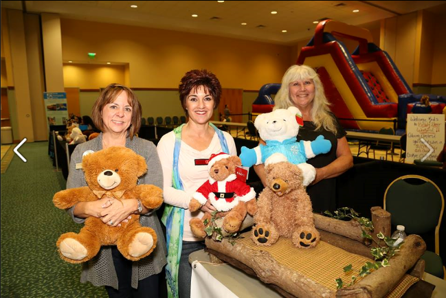 Evie, Beverly and Georgette at the Georgette Richie Upholstery Booth with the Buddy Bear® Bed!