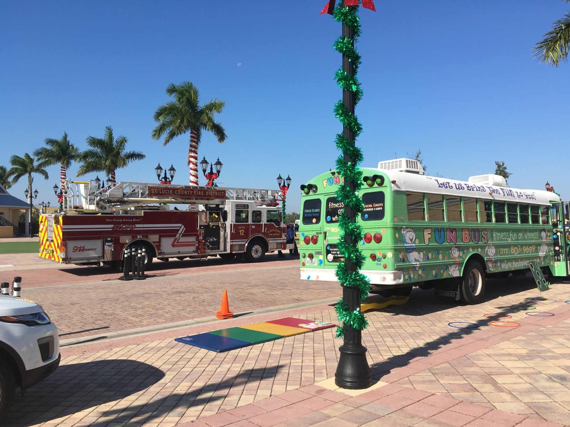 The Fun Bus and the St. Lucie County Fire Engine Outside of The Buddy Bear® Den Entrance