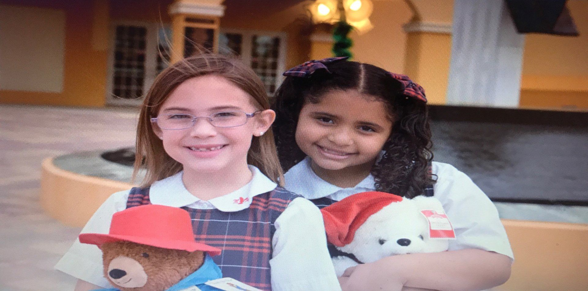 two students from Morningside academy with their Bear donations