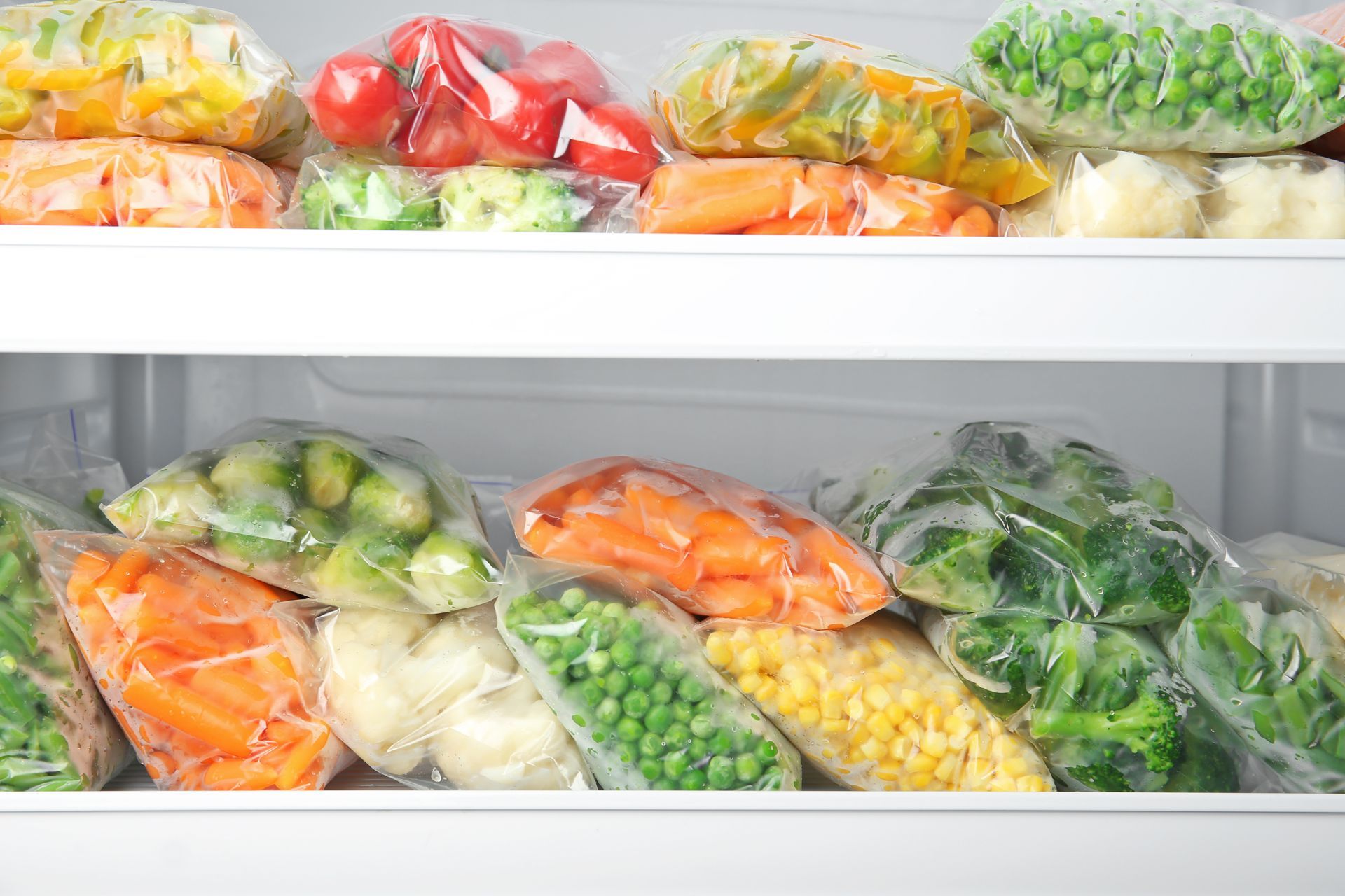 Freezer Filled with Clear Bags of Frozen Vegetables — Lakeside Gas Fridges In Cessnock, NSW