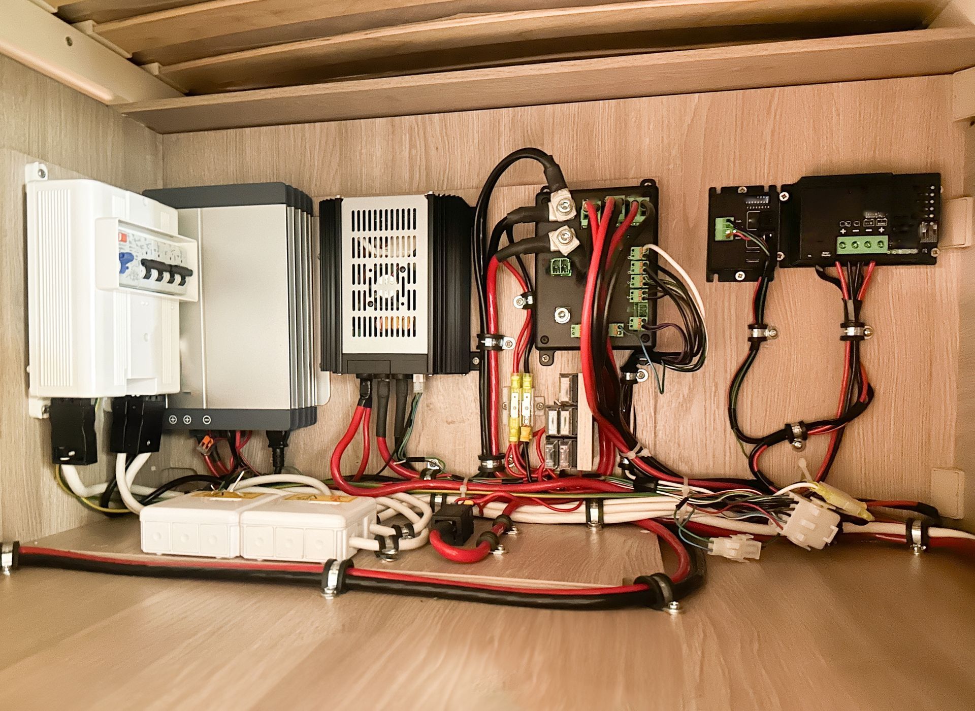 Electrical Components and Wiring Within a Wooden Compartment — Lakeside Gas Fridges In Argenton, NSW