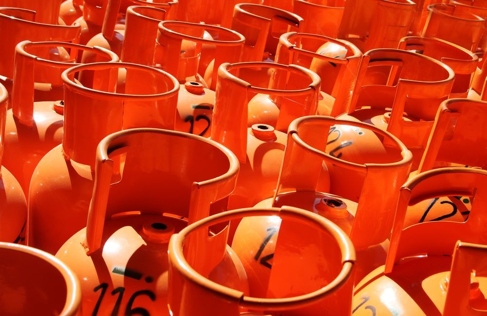 Orange Propane Tanks, Tightly Packed Together — Lakeside Gas Fridges In Cessnock, NSW