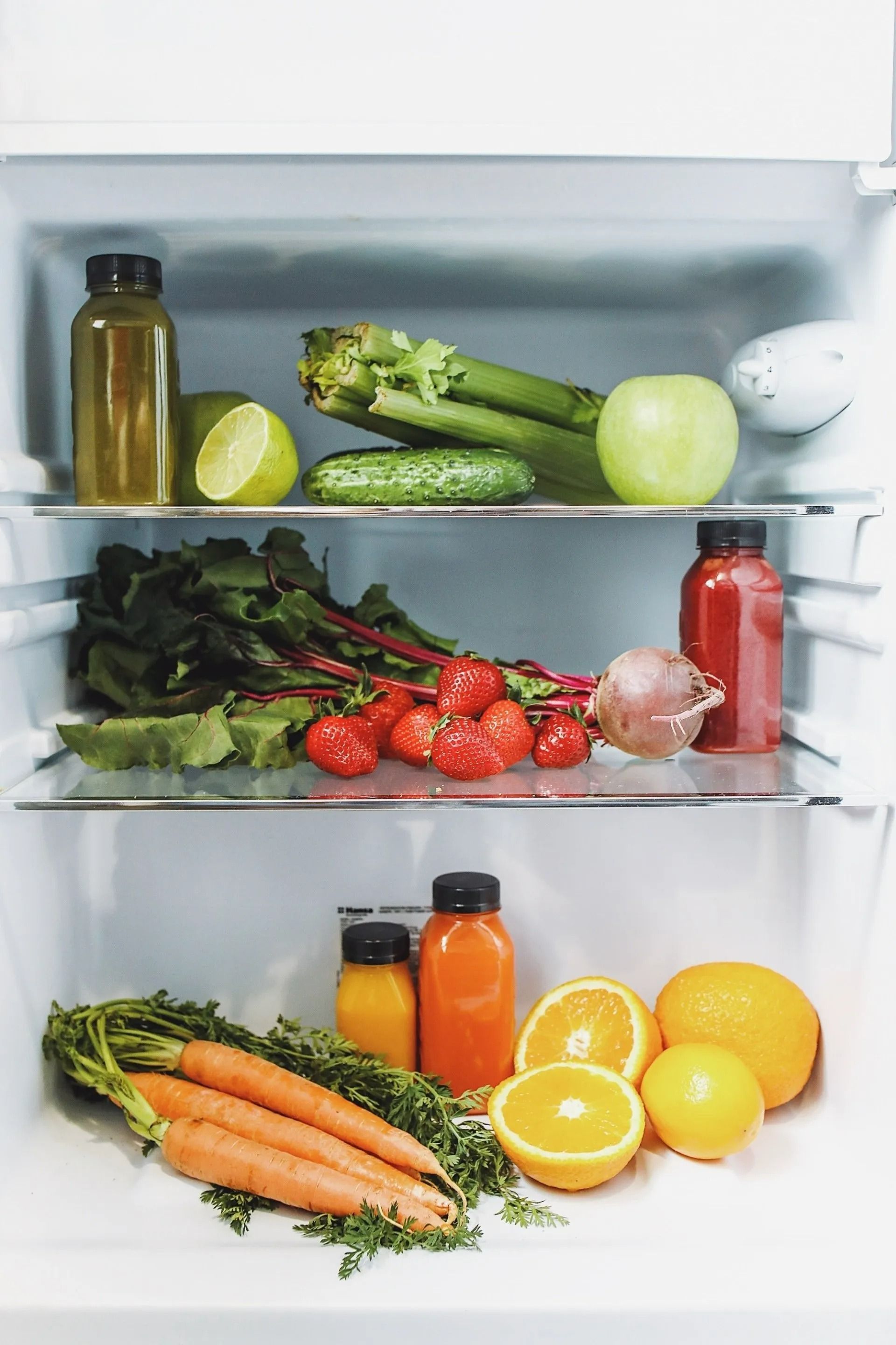 Refrigerator Stocked with Fresh Produce and Juice Bottles — Lakeside Gas Fridges In Argenton, NSW