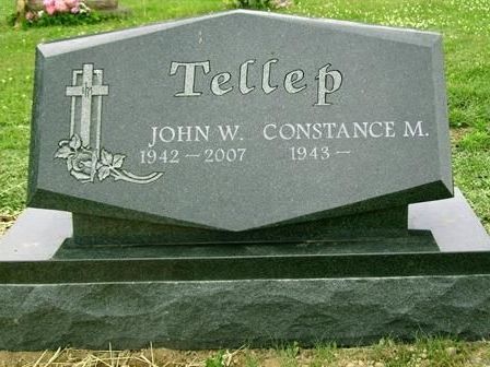 a close up of a sheet of music with a flower in the foreground