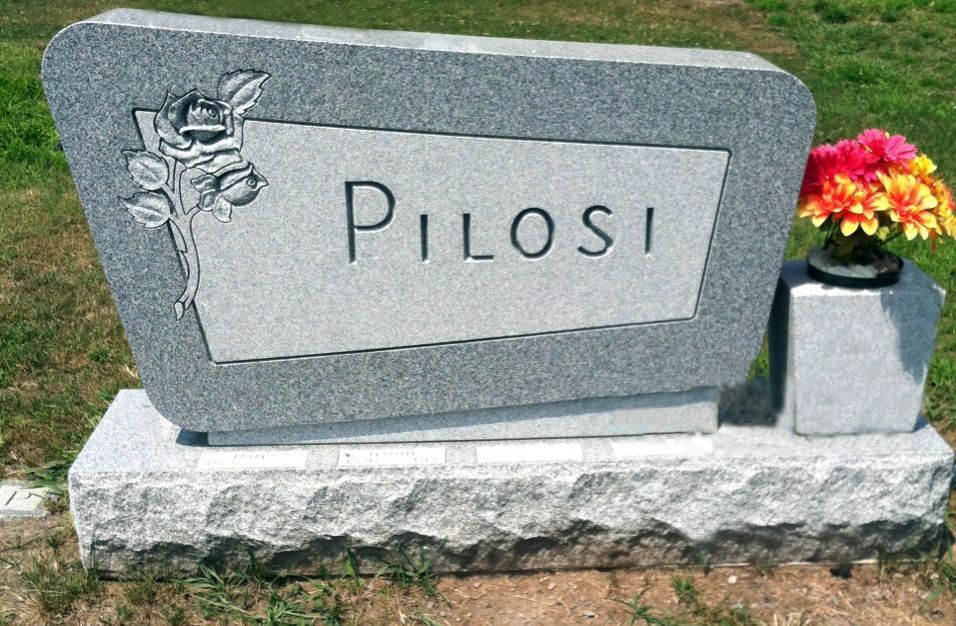 a close up of a sheet of music with a flower in the foreground