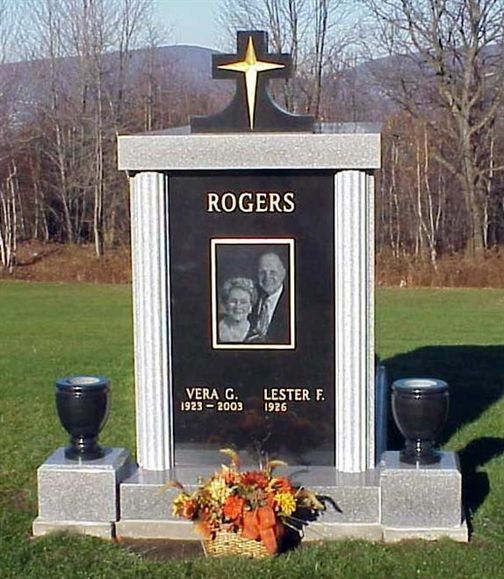 a man in a suit and a woman in a jacket hugging each other