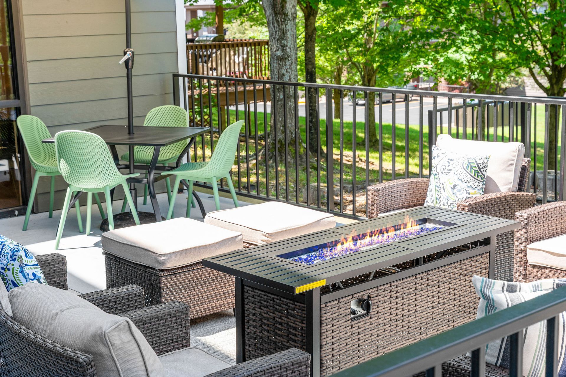There is a fire pit in the middle of the patio.