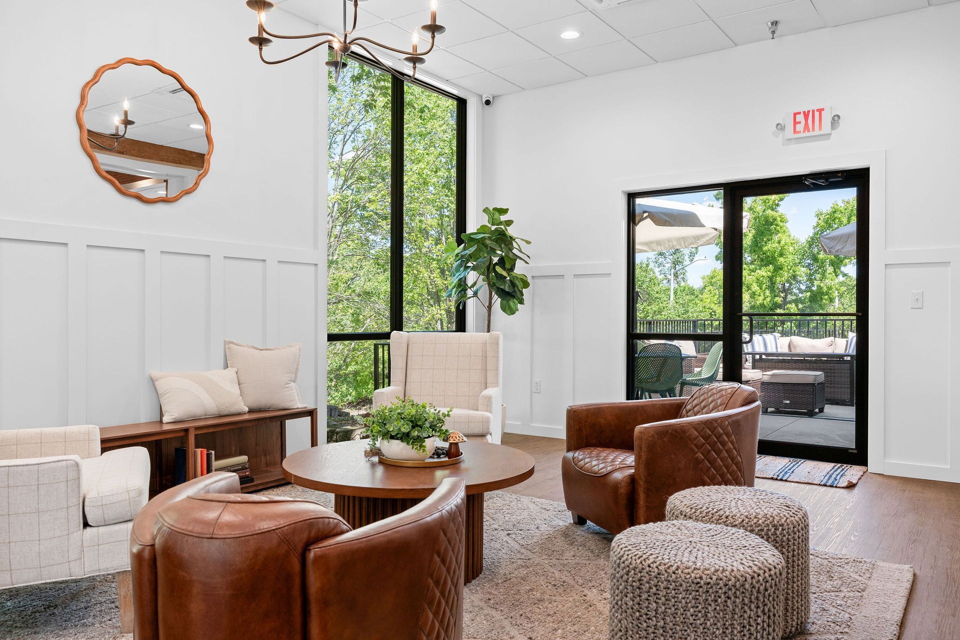 A living room filled with furniture and a large window.