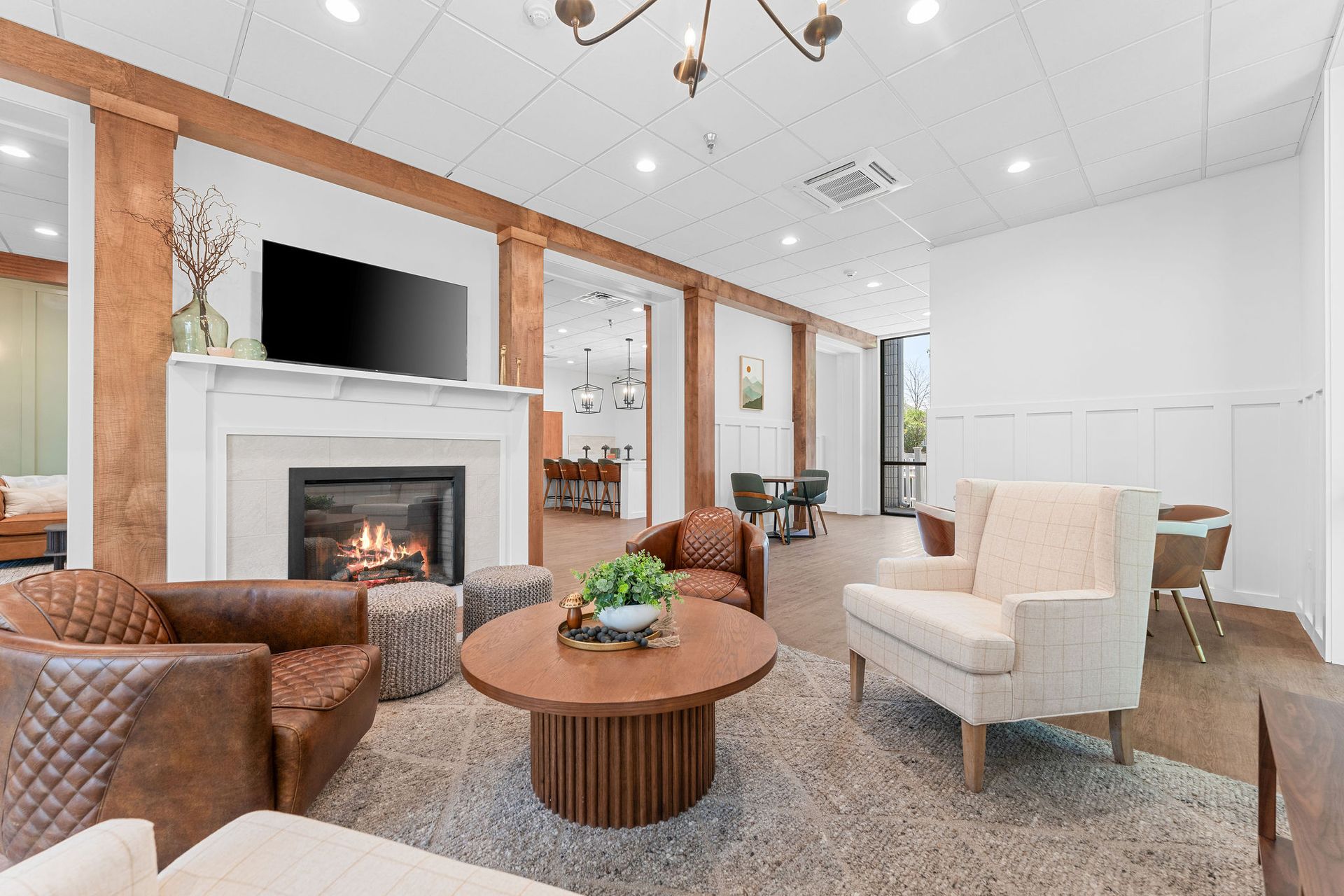 A living room filled with furniture and a fireplace.