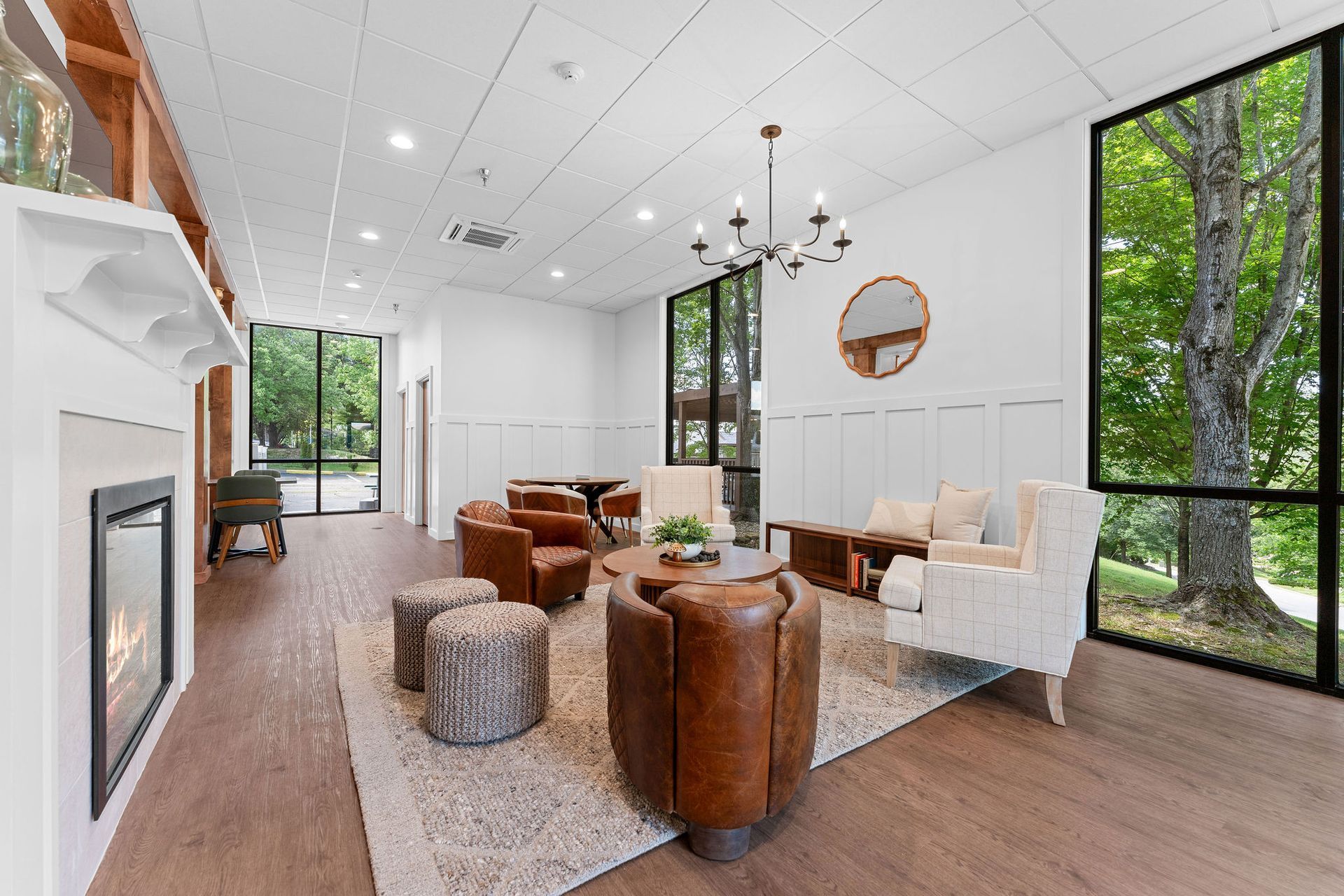 A living room filled with furniture and a fireplace.