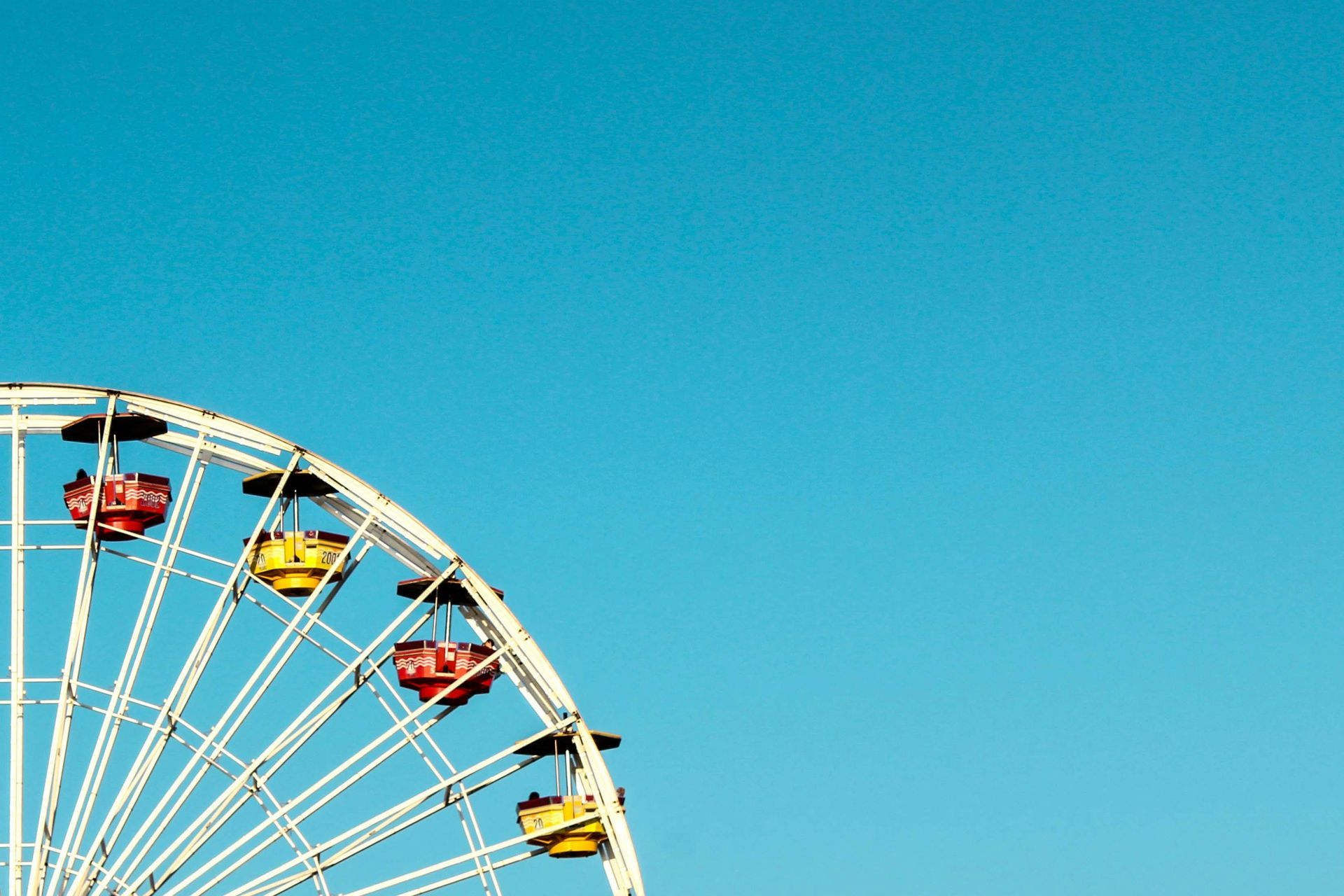 A ferris wheel with a blue sky in the background