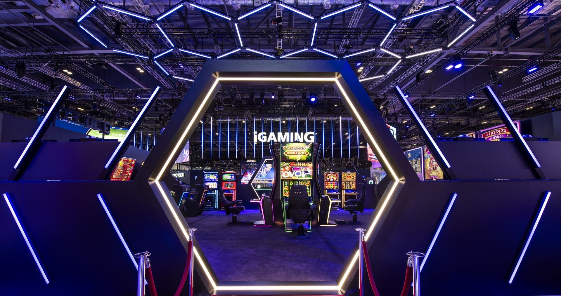 Geometric shapes like hexagons offer brands a more distinctive and ownable way to stand out at a show. These can be rigged LED arrays or floor mounted, both of which are shown in this example below. 