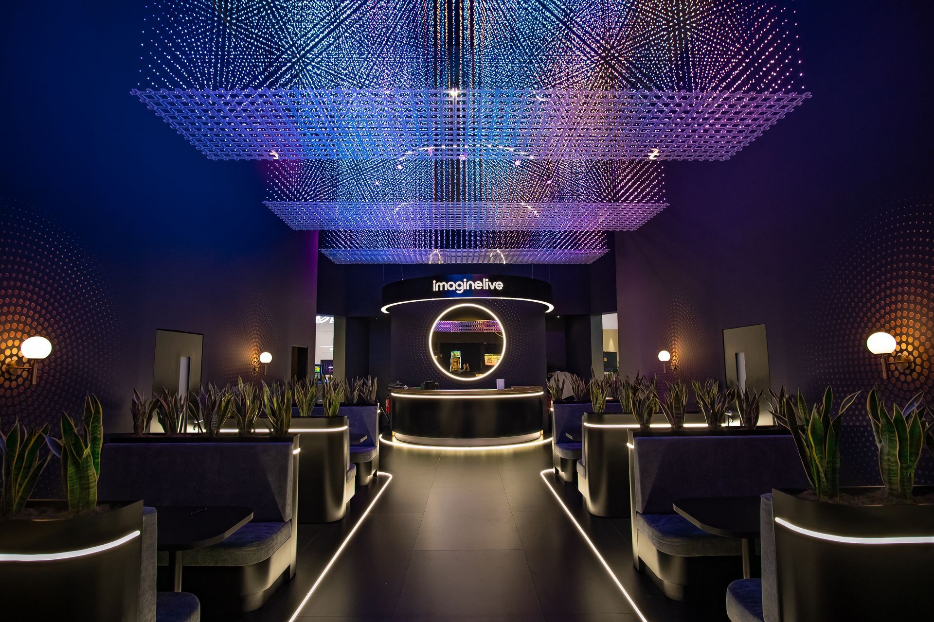 A photograph of the bar and matrix LED feature on the Imagine Live stand at ICE 2026 in Barcelona