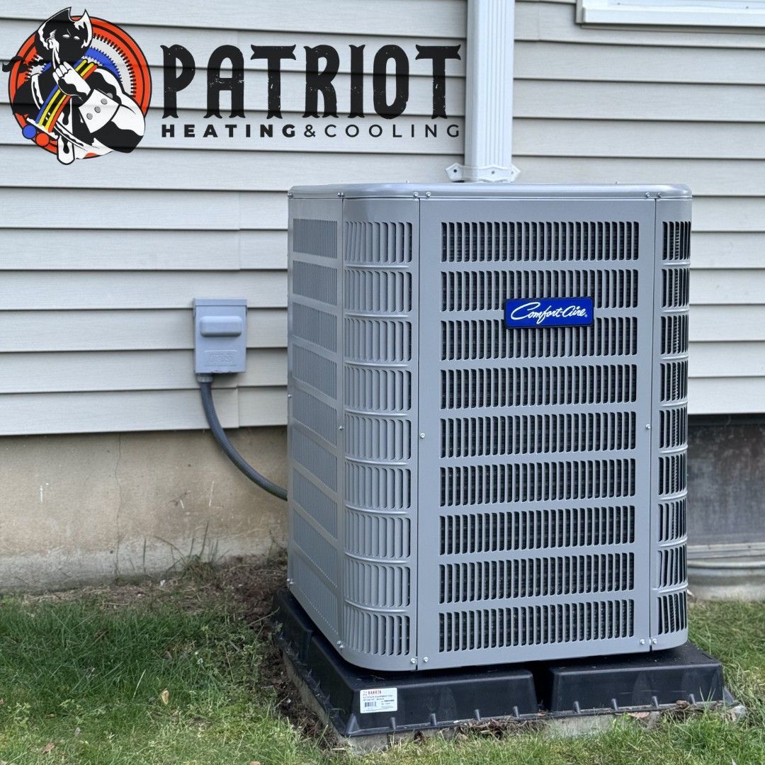 Air conditioner unit outside a home, Patriot Heating & Cooling logo visible.