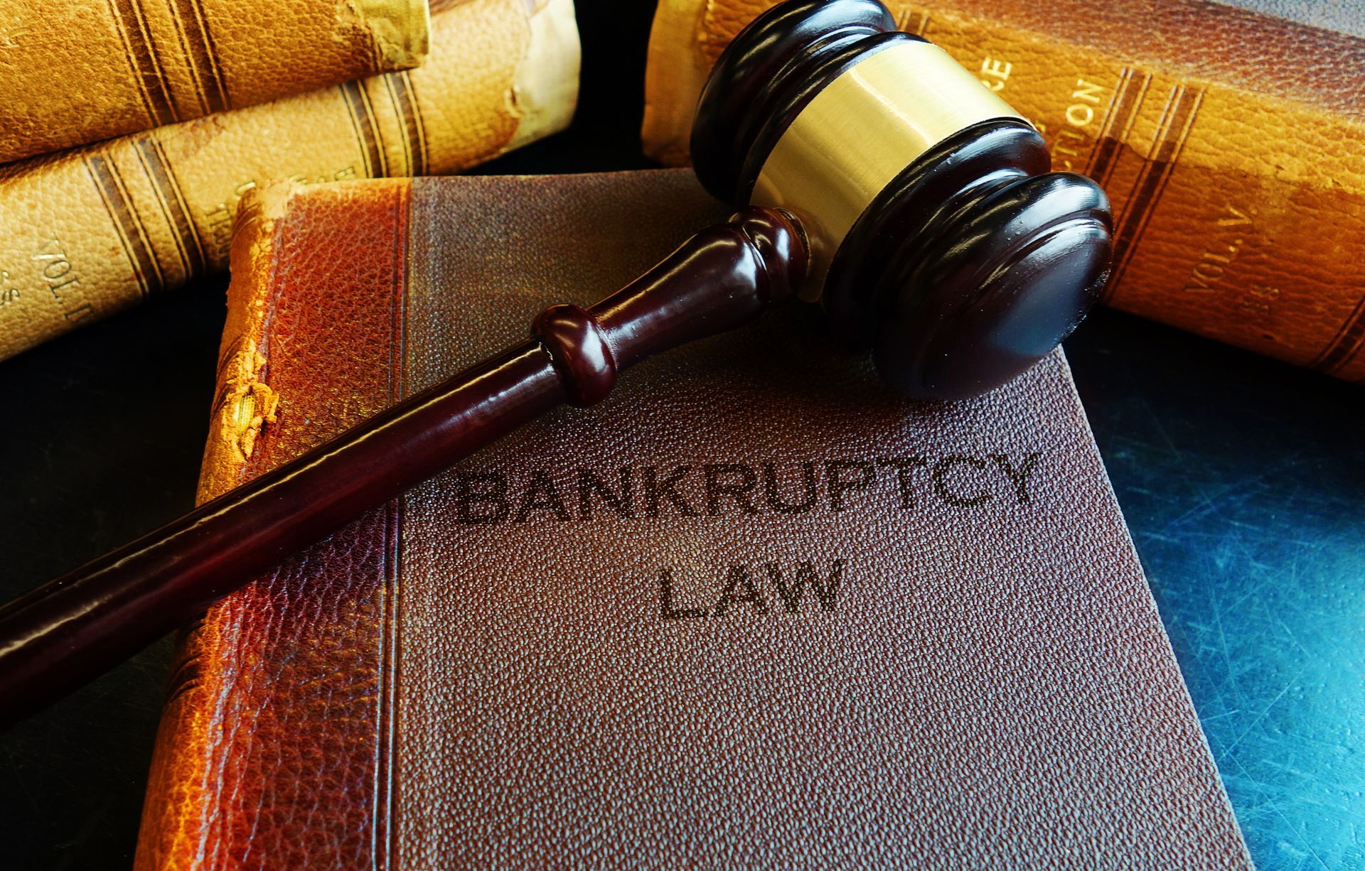 A wooden gavel on a bankruptcy law book, from a bankruptcy attorney.