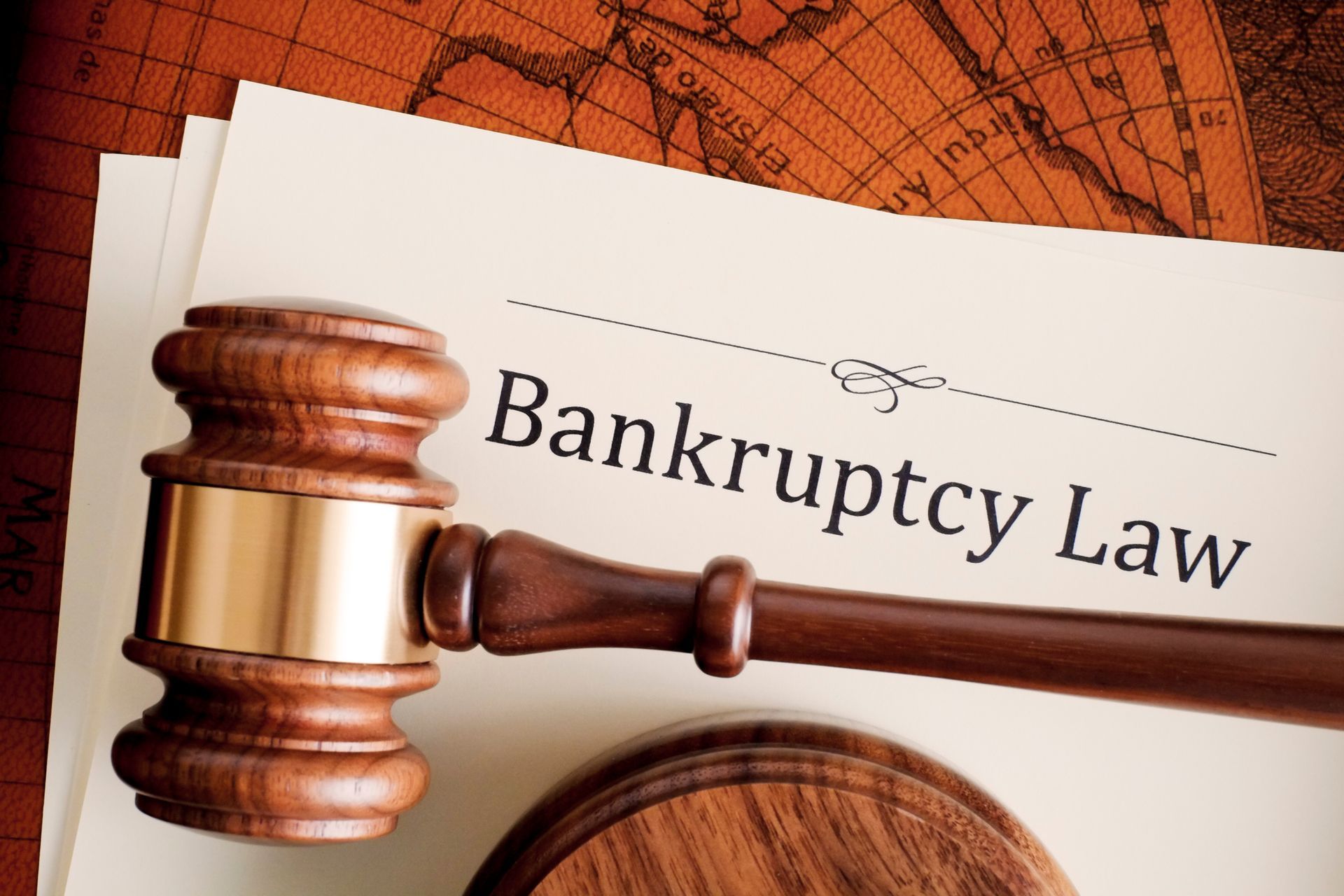 Gavel resting on a document titled Bankruptcy Law.