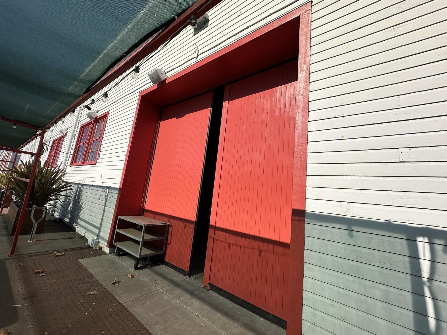 A person is painting a white door with a brush.