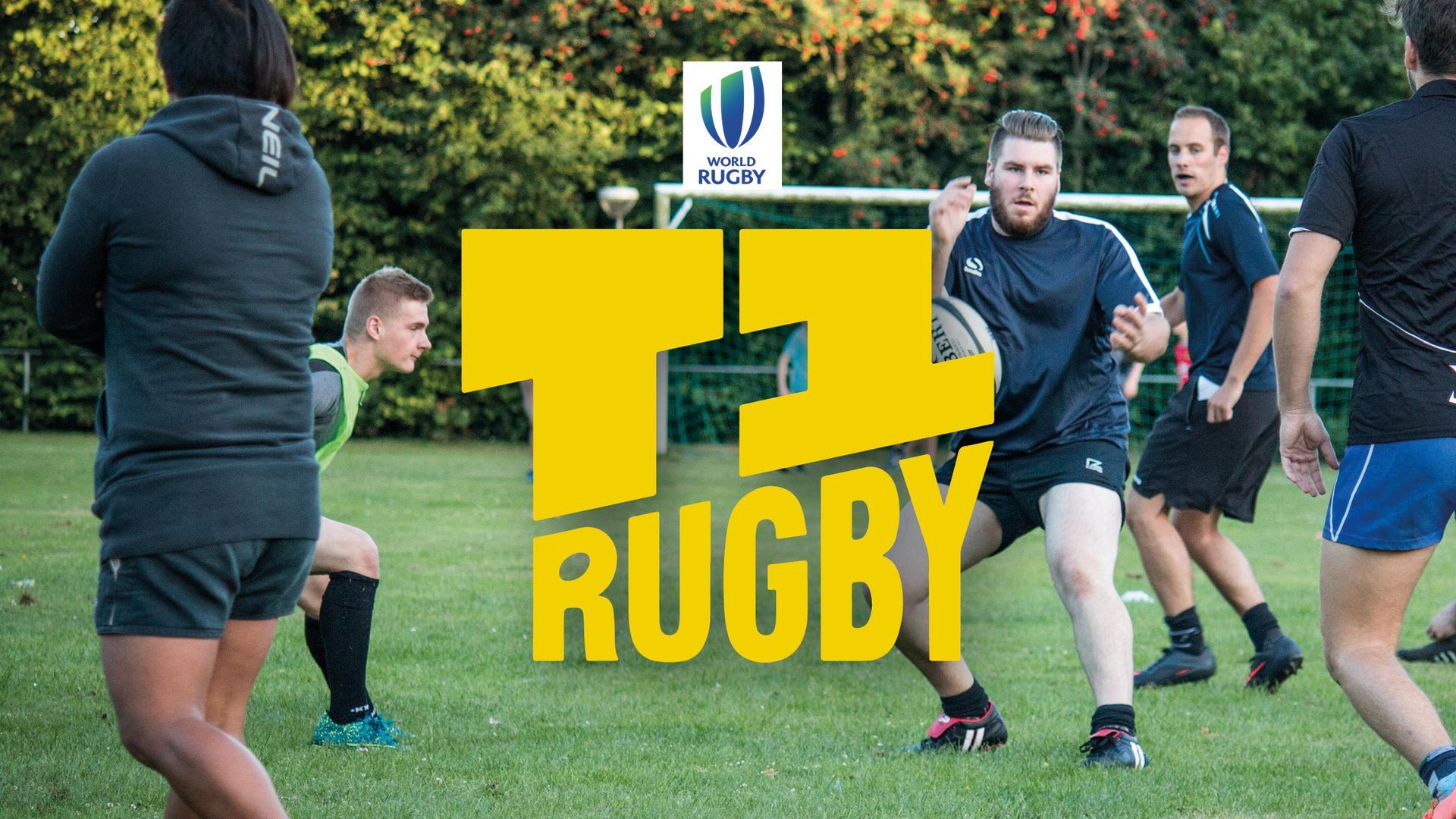 A group of men are playing rugby on a field.