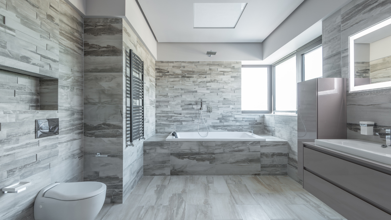A bathroom with a toilet , sink , and bathtub.