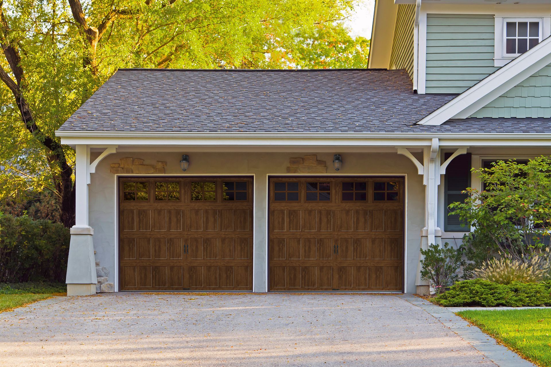 Residential garage door installation with wood-look doors in Waynesboro, VA.