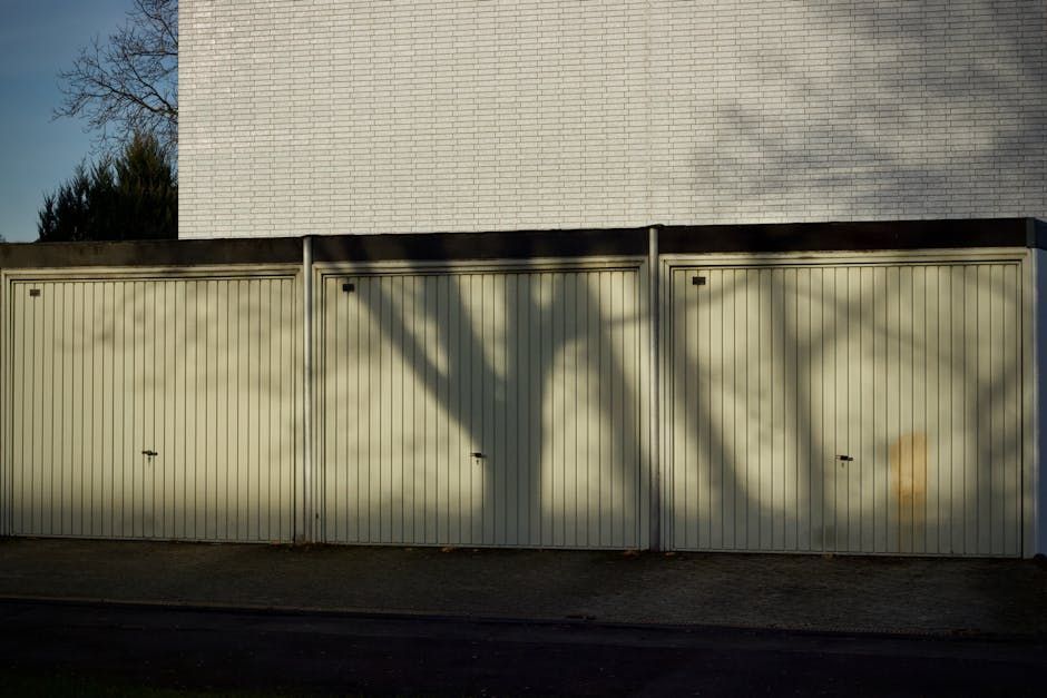 Who are the best local experts to consult about adding insulation in garage door panels for homes in